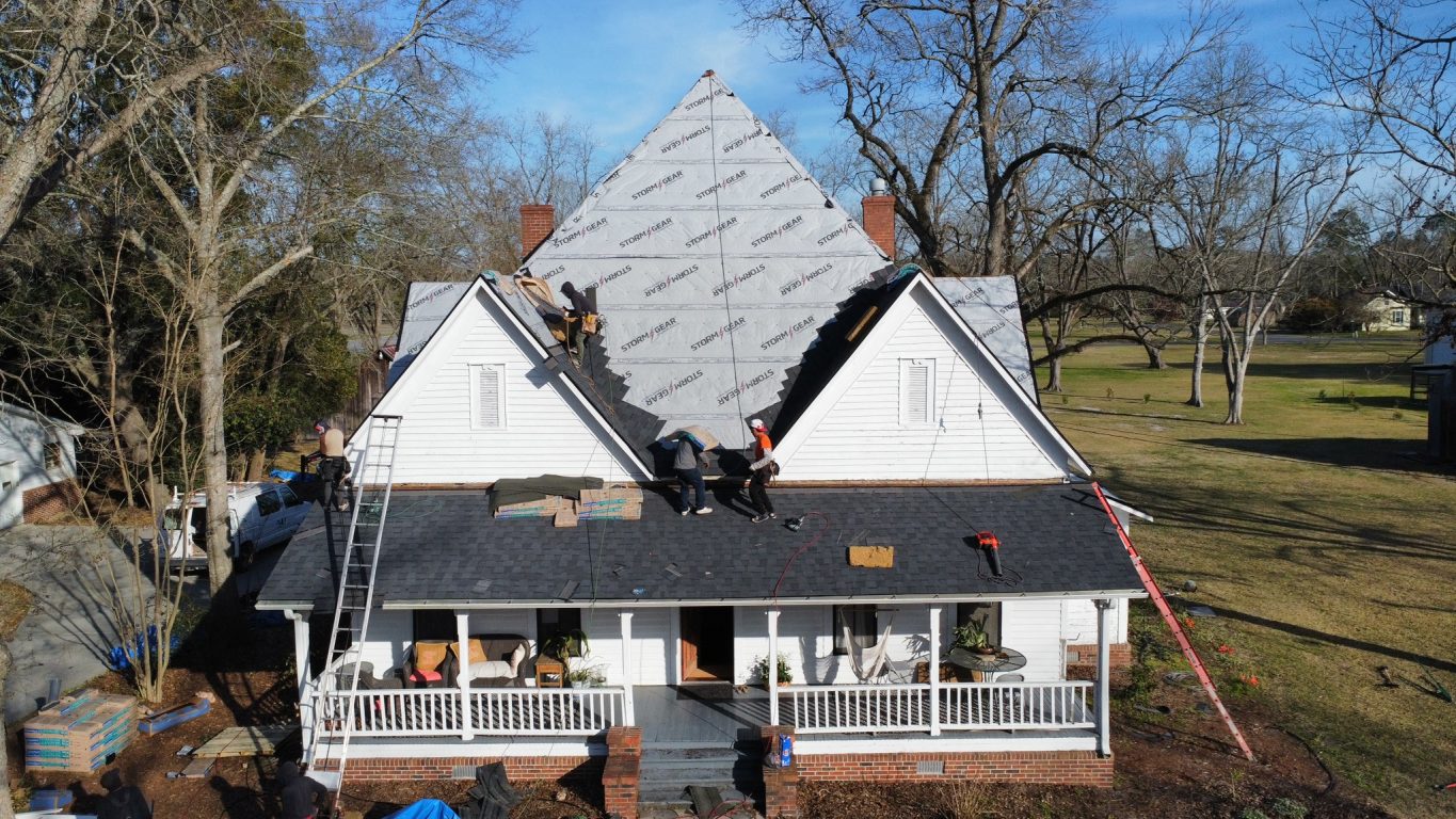 Storm damage claims - roof of home being worked on